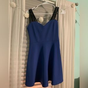 Royal blue with black mesh strap cocktail dress. In excellent condition.
